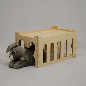 rabbit laying in wooden tunnel