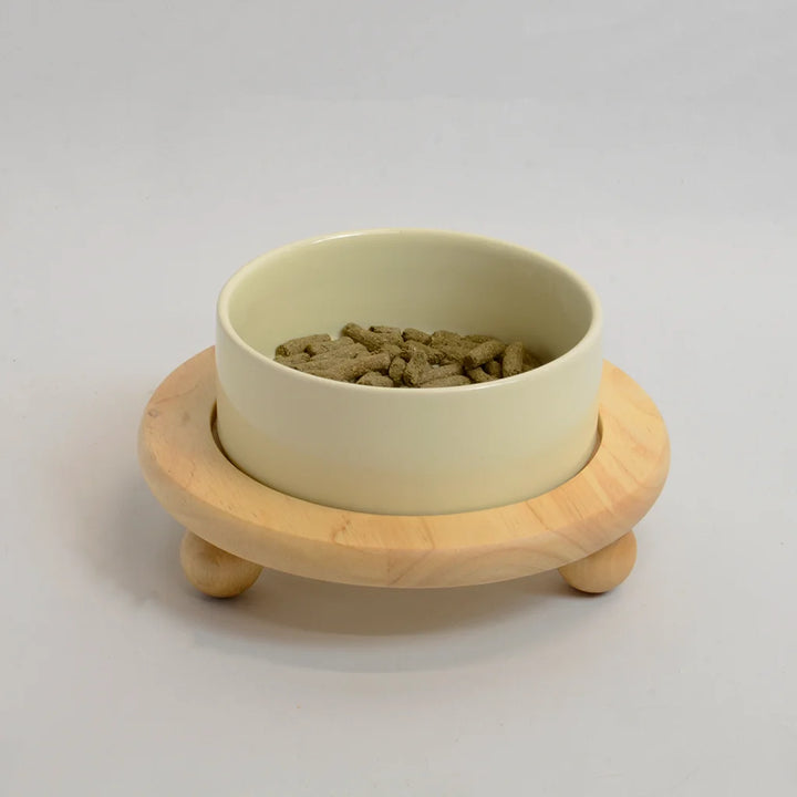 One beige bowl for rabbits on a raised bamboo stand