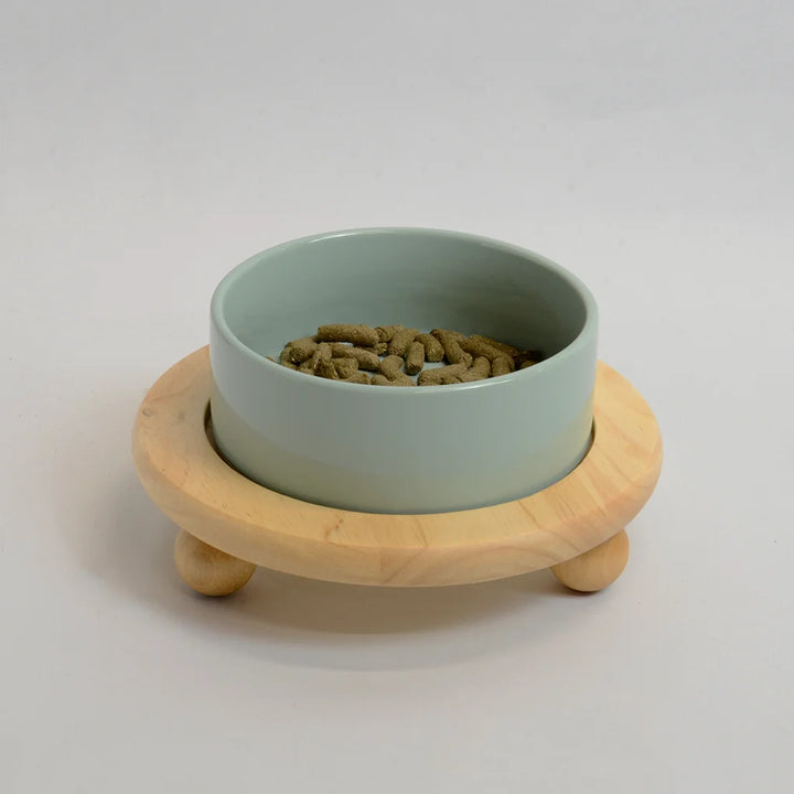 One light green bowl for rabbits on a raised bamboo stand