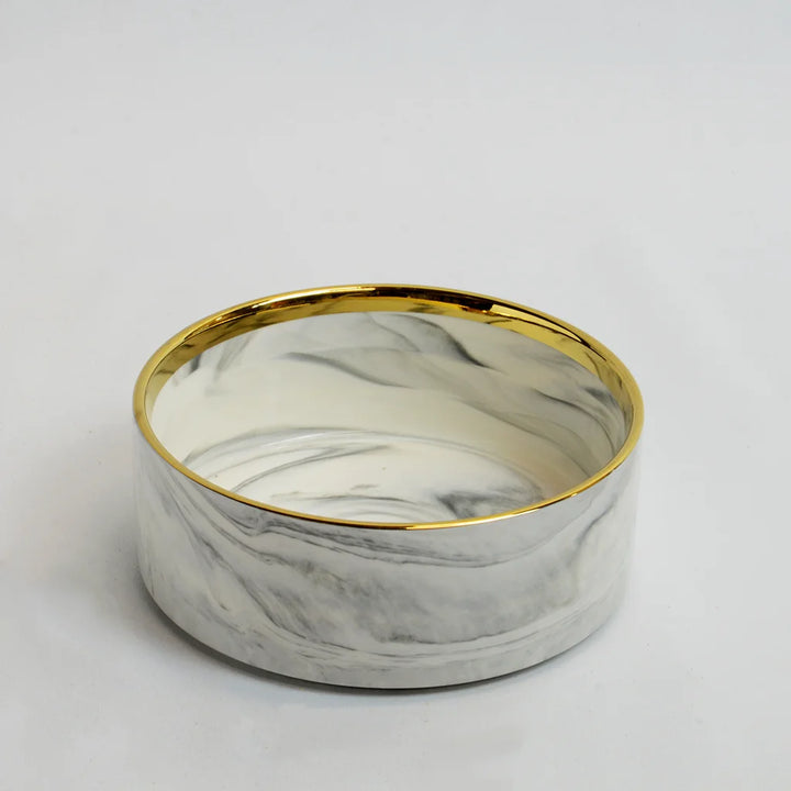 One grey marble-look bowl with gold rim