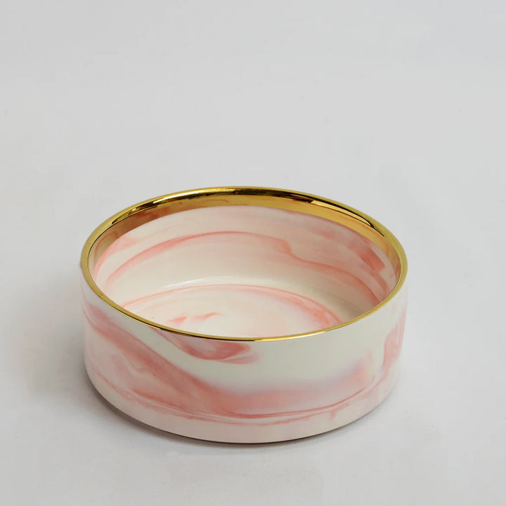 One pink marble-look bowl with gold rim