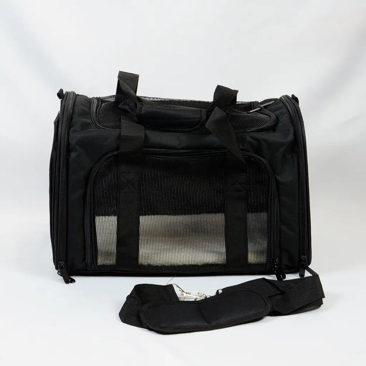 Black travel carrier for rabbits with shoulder band